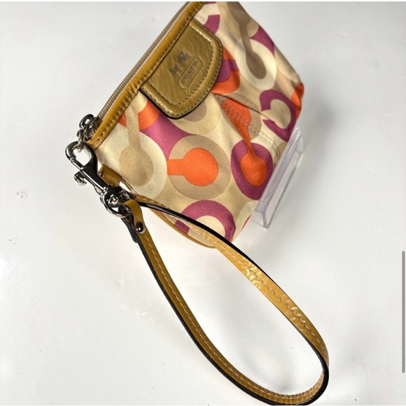 Coach Optic C Colorful Patterned Wristlet
Orange pink cream. Patent Leather - Picture 8 of 10
